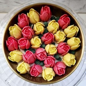 Festive Floral Candle with Pink and Yellow Roses